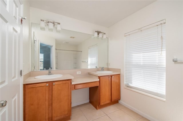 bathroom featuring a shower, tile patterned flooring, and vanity