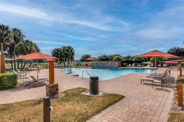 view of swimming pool with a patio area