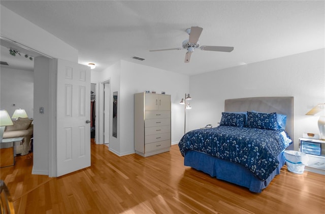 bedroom featuring ceiling fan and wood-type flooring