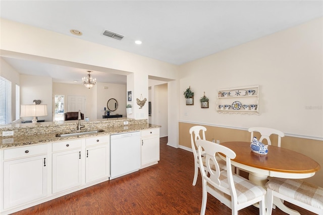 kitchen featuring white dishwasher, sink, white cabinetry, and dark wood-type flooring