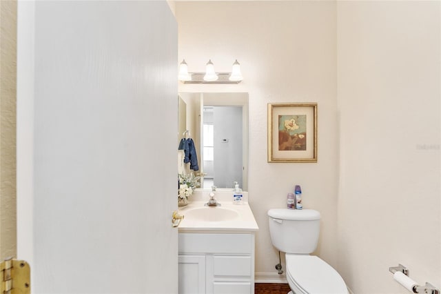 bathroom featuring vanity and toilet