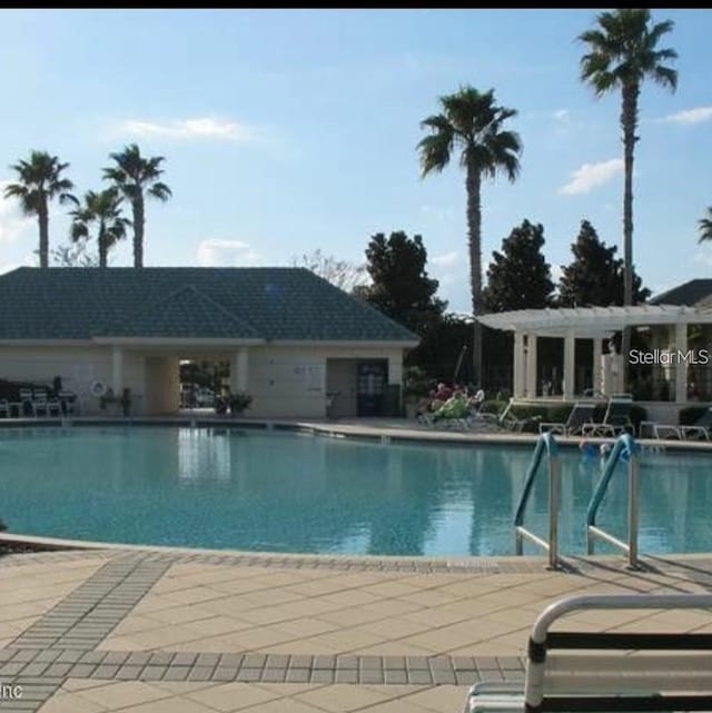 view of pool featuring a patio