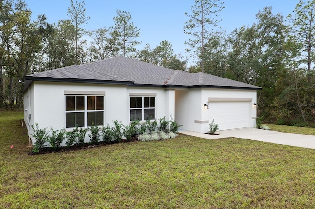 view of front of house with a front yard and a garage