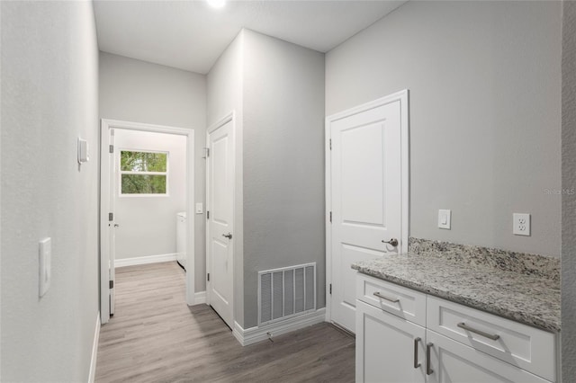 hallway featuring light hardwood / wood-style flooring