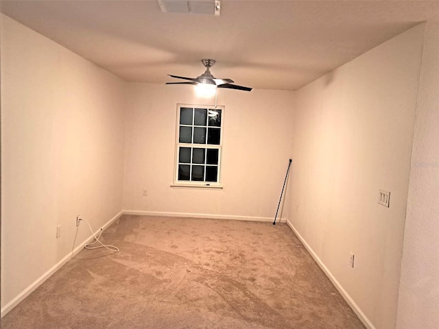 unfurnished room featuring carpet and ceiling fan