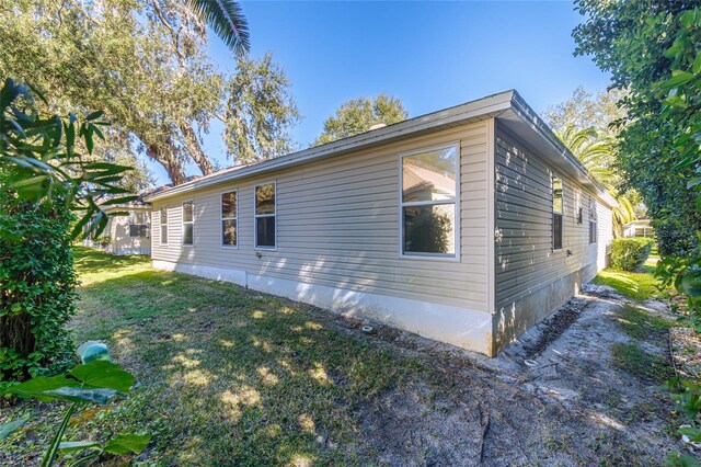 view of home's exterior featuring a yard