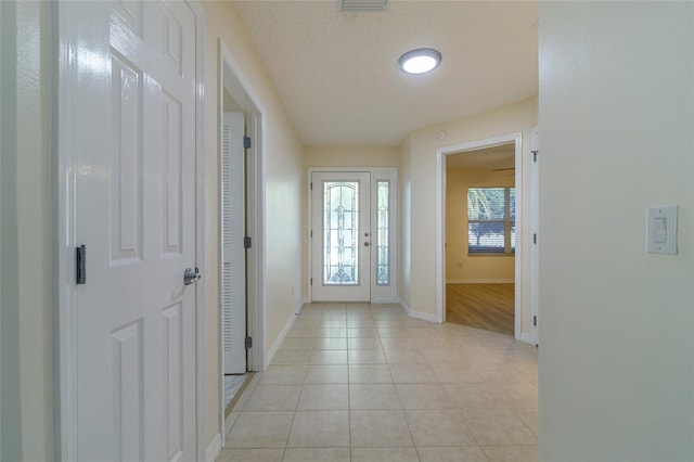 interior space with a textured ceiling