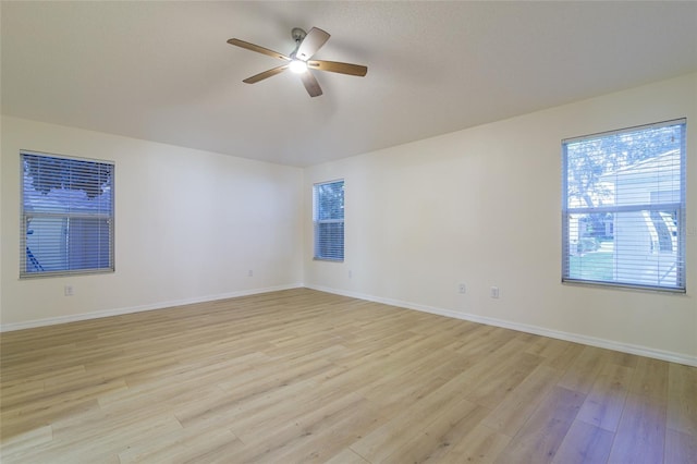 empty room with light wood-type flooring and ceiling fan