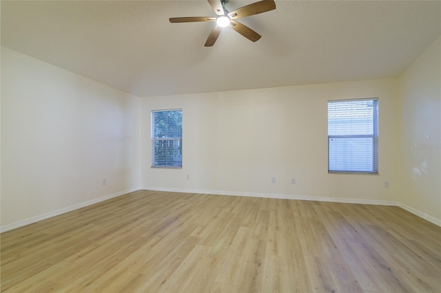 spare room featuring ceiling fan and light wood-type flooring