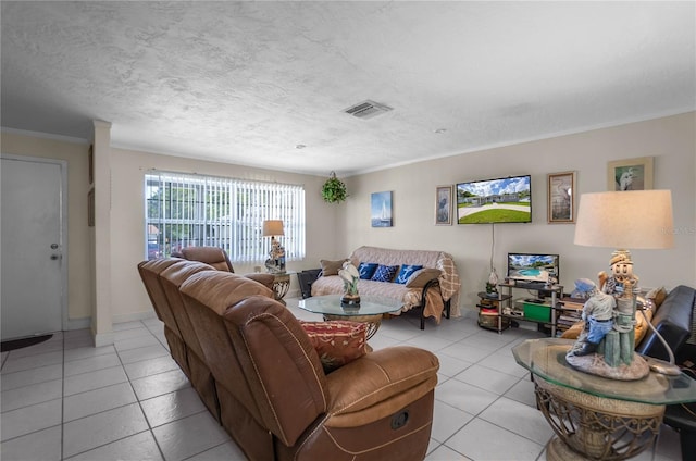 living room featuring a textured ceiling, crown molding, and light tile patterned flooring