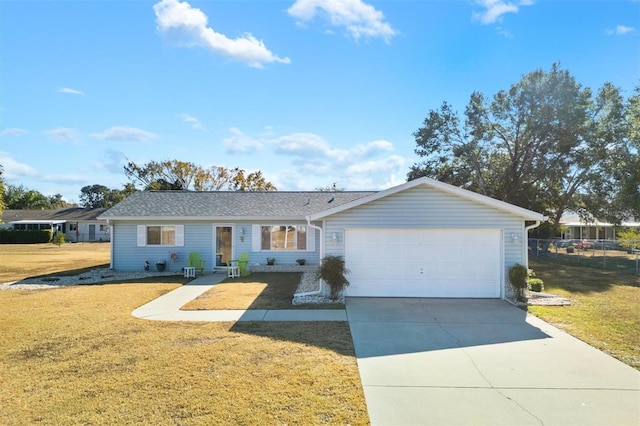 single story home with a garage and a front lawn