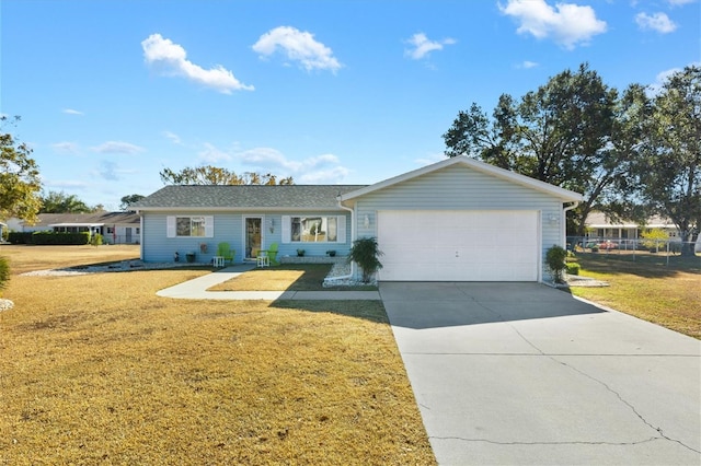 ranch-style home with a garage and a front lawn