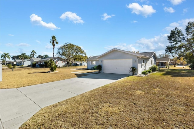 exterior space with a garage and a front lawn