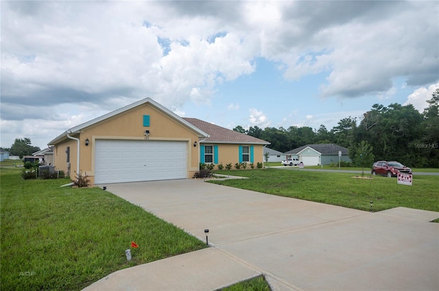 view of front of property featuring a garage and a front lawn