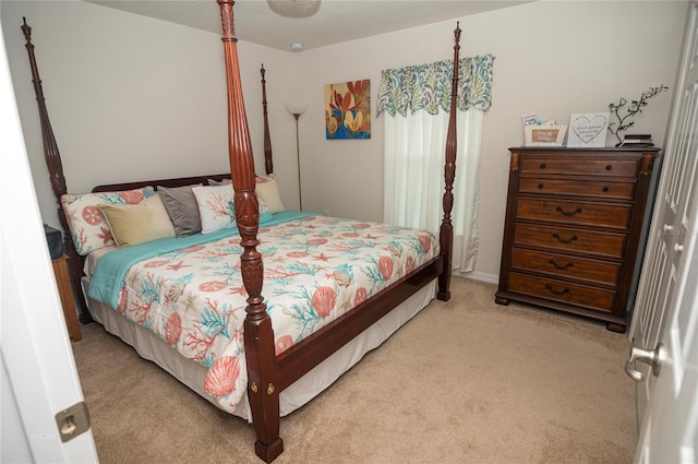 bedroom with light colored carpet