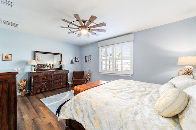 bedroom featuring ceiling fan and dark hardwood / wood-style flooring