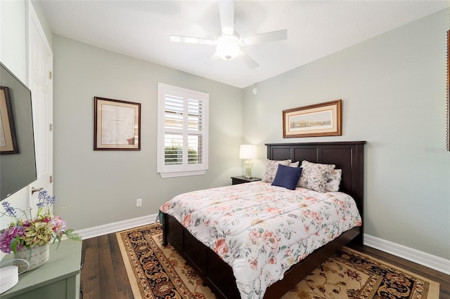 bedroom with ceiling fan and dark wood-type flooring