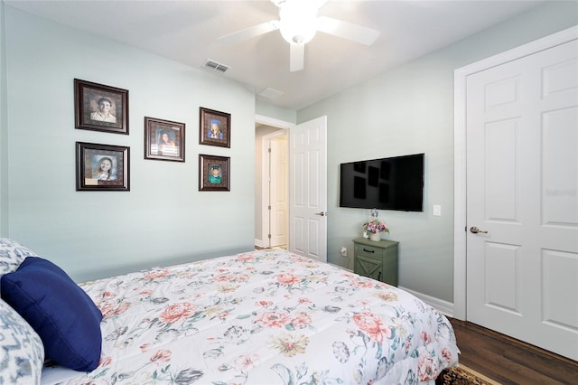 bedroom featuring ceiling fan and dark wood-type flooring