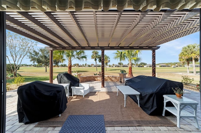 view of patio / terrace with a grill and a pergola