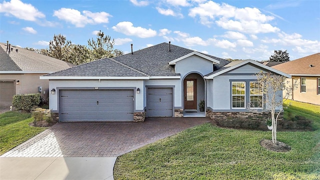 single story home featuring a front yard and a garage