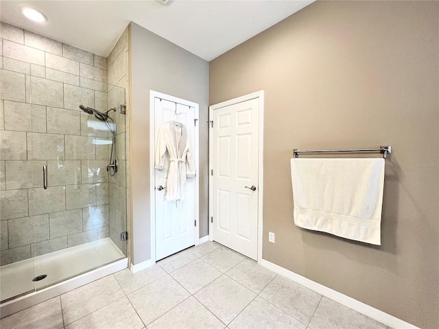 bathroom featuring tile patterned flooring and walk in shower