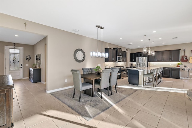 dining area with light tile patterned floors