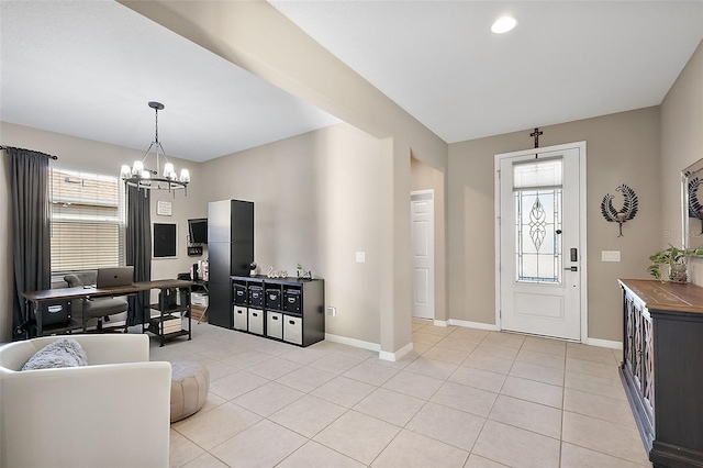 foyer entrance featuring a chandelier and light tile patterned flooring