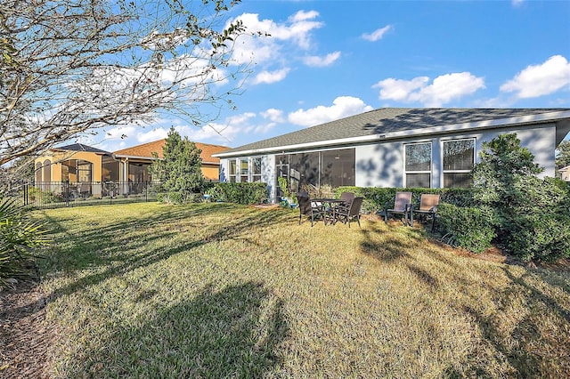 view of yard featuring a sunroom