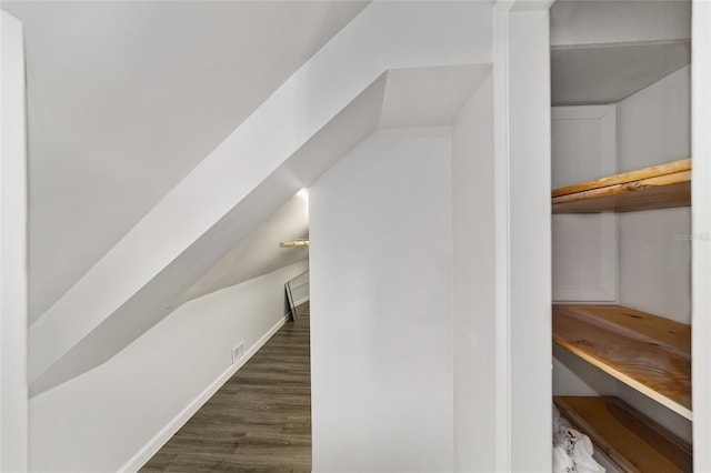 bonus room featuring dark wood-type flooring