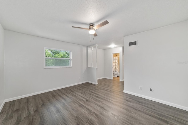 unfurnished room featuring ceiling fan, dark hardwood / wood-style flooring, and a textured ceiling