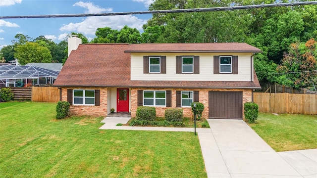 split level home with a front lawn and a garage