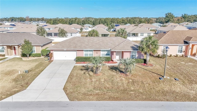 view of front of home featuring a garage and a front lawn