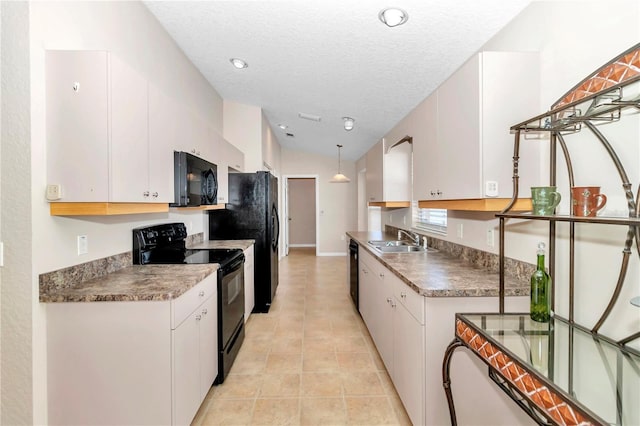 kitchen featuring black appliances, white cabinetry, sink, and hanging light fixtures