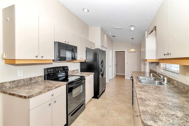 kitchen featuring white cabinetry, sink, a textured ceiling, decorative light fixtures, and black appliances