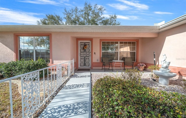 entrance to property featuring covered porch