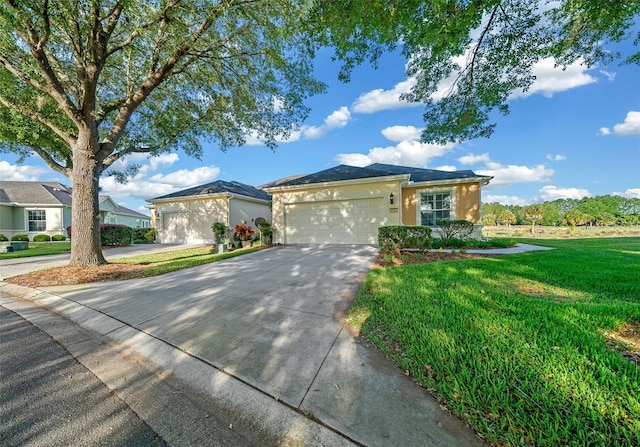 ranch-style house featuring a front lawn and a garage