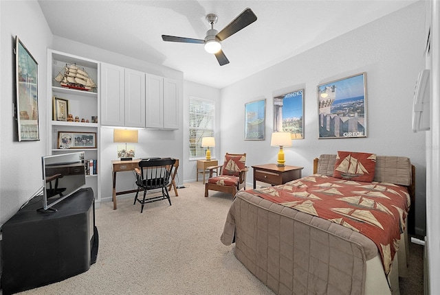 bedroom featuring ceiling fan and light colored carpet