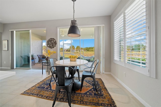 dining area featuring tile patterned flooring