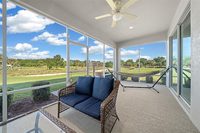 sunroom with ceiling fan