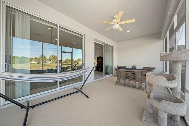 sunroom / solarium with ceiling fan and a healthy amount of sunlight