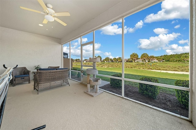 sunroom / solarium with ceiling fan