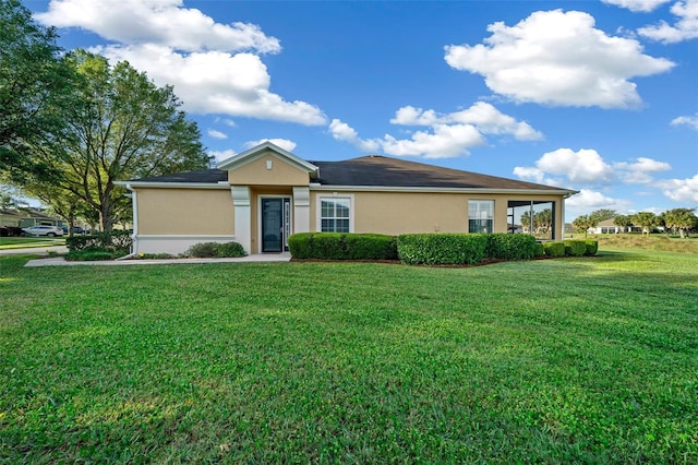 ranch-style home with a front lawn