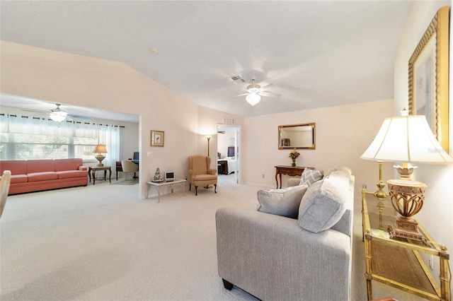 carpeted living room featuring ceiling fan and lofted ceiling