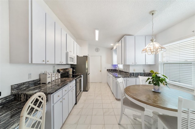 kitchen with pendant lighting, stainless steel appliances, white cabinetry, and sink