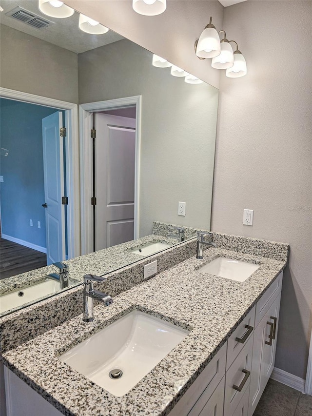 bathroom featuring vanity and wood-type flooring