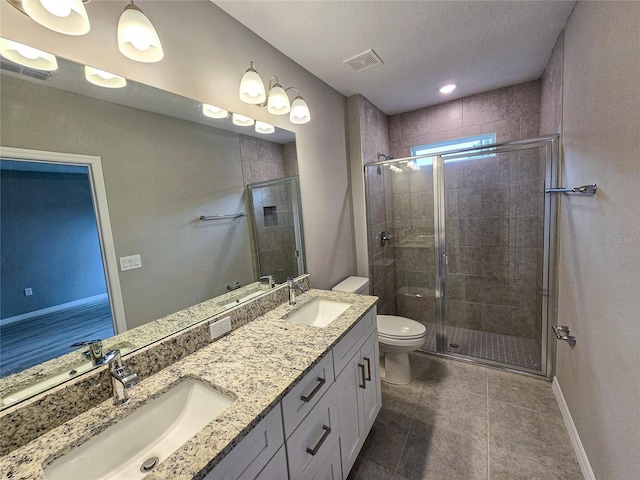 bathroom featuring tile patterned flooring, toilet, and walk in shower