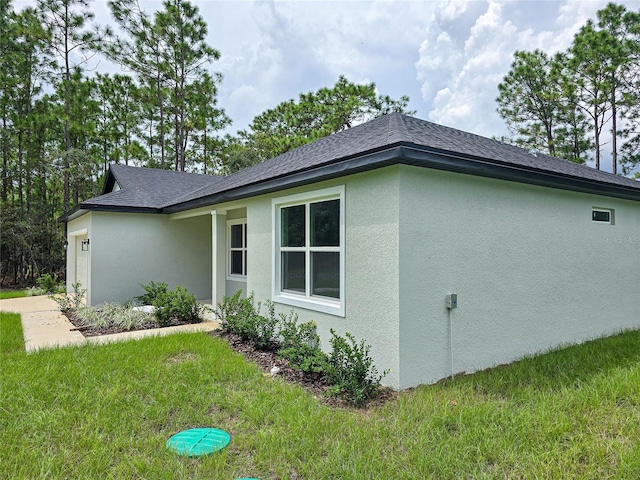 view of home's exterior with a yard