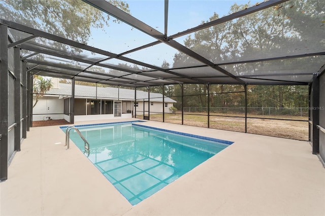 view of swimming pool with a lanai and a patio