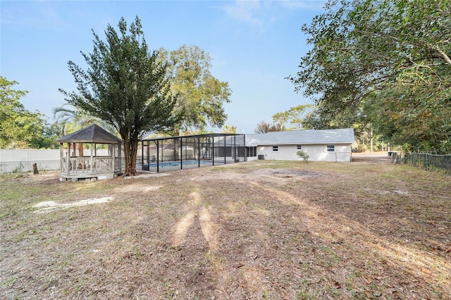 view of yard with a gazebo and a fenced in pool