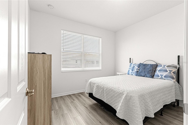 bedroom with light wood-type flooring